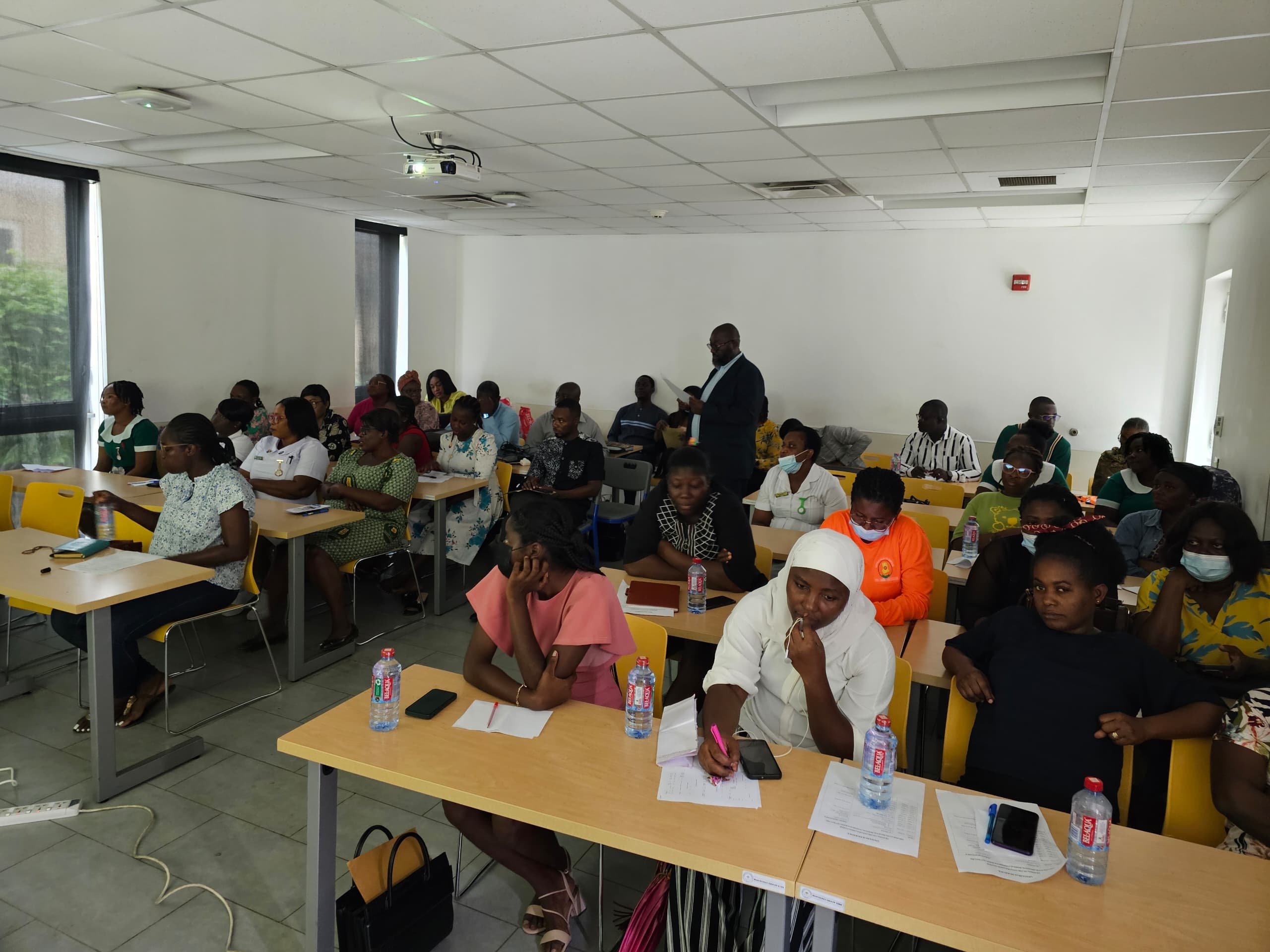 Health workers at workstations during LHIMS training