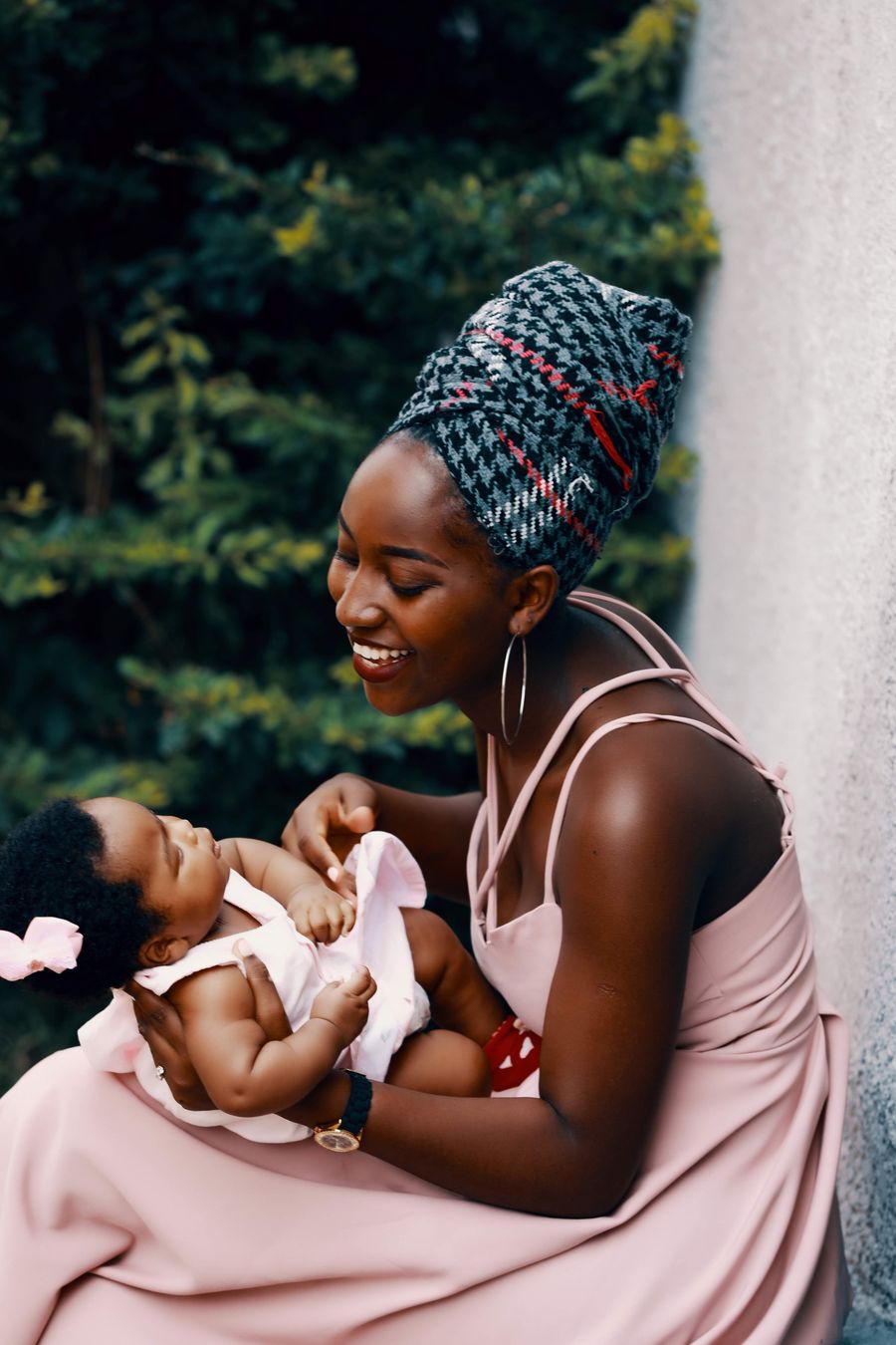 A mother holds her newborn at a health facility in Ghana