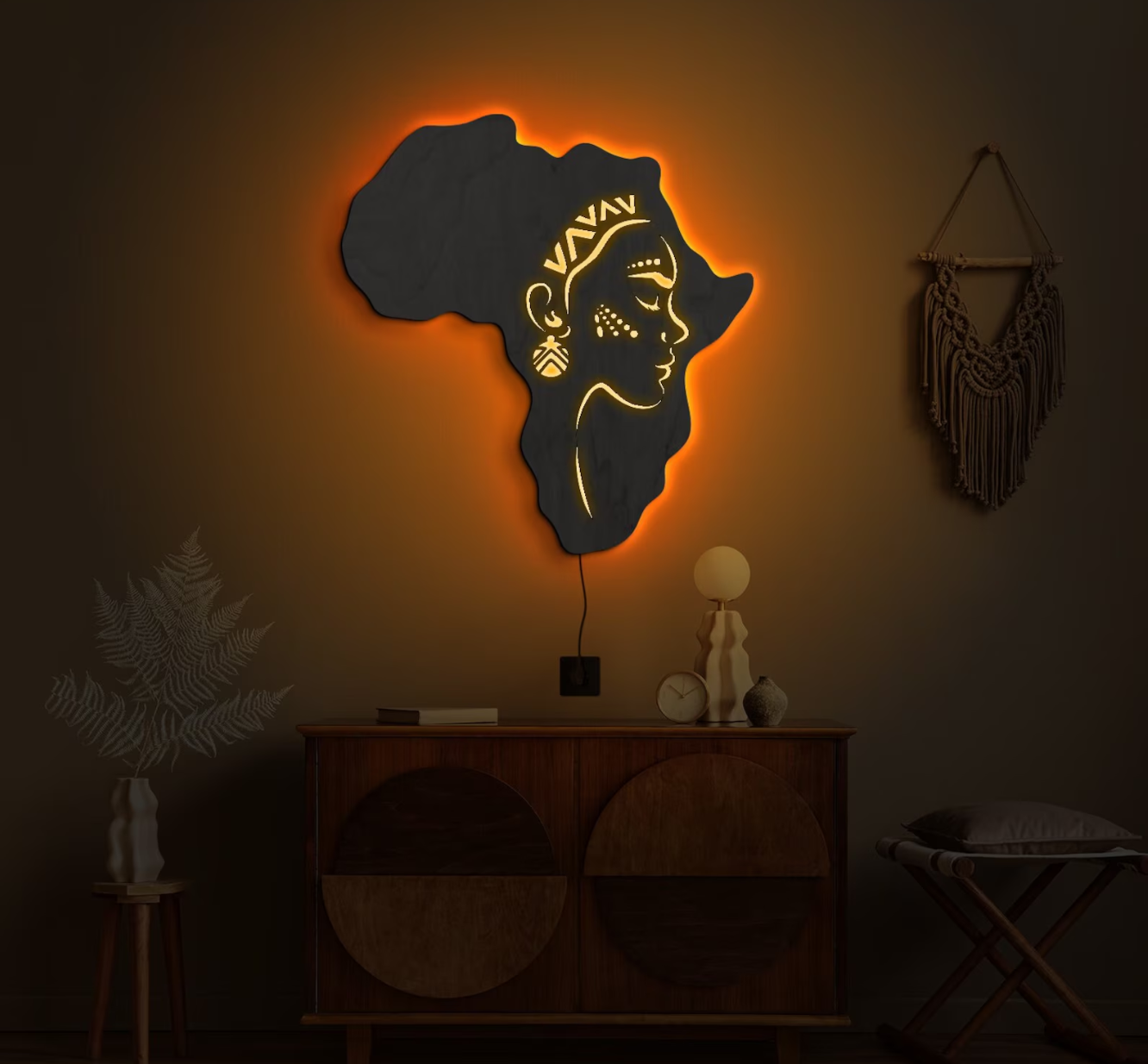 Illuminated map of Africa wall art in a Ghanaian interior